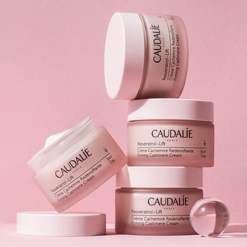 Premium cosmetic packaging trends with eco-friendly containers, elegant typography, and modern branding elements.