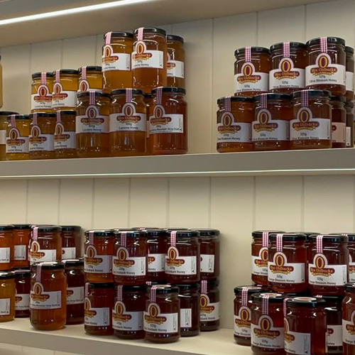 Honey Packaging in a glass jar assembled in shelfs