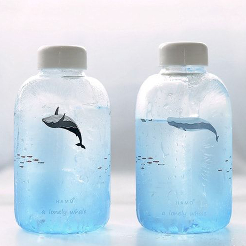 Water bottle packaging featuring wave-inspired shapes and refreshing visuals