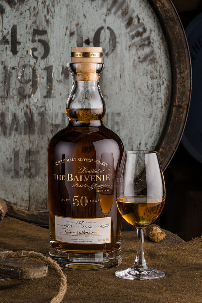 Luxury spirits branding with embossed labels and gold foil finishes