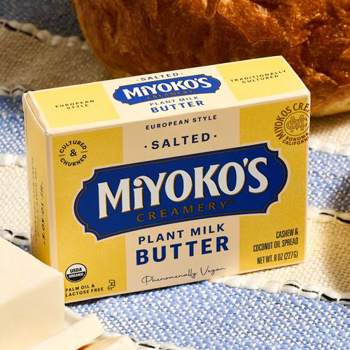 Eco-friendly dairy product packaging showcasing sustainable cartons, glass jars, and recyclable containers.