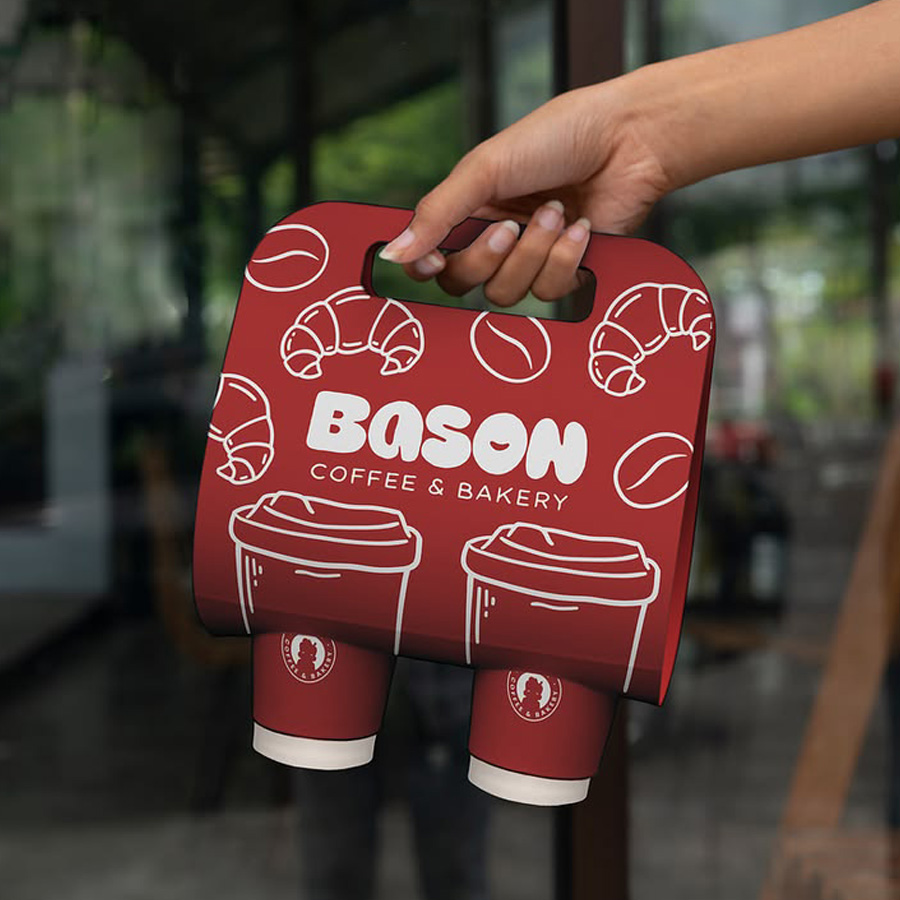 Drink carrier showcasing brand logo of bakery business and services